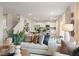 Bright open-concept living room with contemporary decor, stylish furnishings, and hardwood floors at 8503 Polston Lot 142 Pl, Douglasville, GA 30134