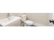 Stylish half bathroom features a floating vanity and modern fixtures at 148 Palm St, Holly Springs, GA 30115