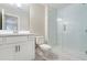 This bathroom features a large glass enclosed shower and a modern vanity at 148 Palm St, Holly Springs, GA 30115