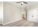Bright bedroom features neutral carpeting, a ceiling fan, and a double door closet at 148 Palm St, Holly Springs, GA 30115