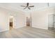 This bedroom features neutral carpet, crown molding, and multiple doorways at 148 Palm St, Holly Springs, GA 30115