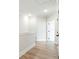 Bright hallway with wood floors and white trim, connecting various rooms in the home at 148 Palm St, Holly Springs, GA 30115