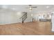 Open floor plan showcasing hardwood floors and seamless transition to the kitchen at 148 Palm St, Holly Springs, GA 30115