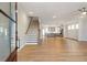 Bright and airy living room featuring hardwood floors and an open floor plan at 148 Palm St, Holly Springs, GA 30115