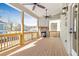 Inviting outdoor patio features a stone fireplace and wooden railings, perfect for relaxation at 148 Palm St, Holly Springs, GA 30115