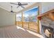 Outdoor patio with stone fireplace and view of surrounding neighborhood homes at 148 Palm St, Holly Springs, GA 30115