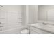 Well-lit bathroom with a tub and shower combo, paired with a vanity and stylish fixtures at 1628 Palladian Dr, Lithonia, GA 30058