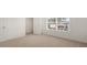 Cozy bedroom with neutral carpet, closet, and a large window for plenty of natural light at 1628 Palladian Dr, Lithonia, GA 30058
