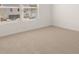 Neutral carpeted bedroom with a large window offering great natural light at 1628 Palladian Dr, Lithonia, GA 30058