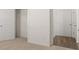 Bright bedroom with a closet and neutral carpet, showcasing a clean and minimalist design at 1628 Palladian Dr, Lithonia, GA 30058