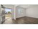 Bright entryway featuring wood-look flooring, white walls, and an open door to the exterior at 1628 Palladian Dr, Lithonia, GA 30058