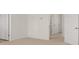 Bright, neutral hallway with white doors on either side showcasing modern design at 1628 Palladian Dr, Lithonia, GA 30058