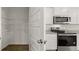 Modern kitchen features stainless appliances, granite countertops, and a walk-in pantry at 1628 Palladian Dr, Lithonia, GA 30058