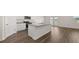 Open kitchen featuring a central island with granite countertops and ample cabinet space at 1628 Palladian Dr, Lithonia, GA 30058