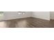 Spacious living room features hardwood floors and bright sunlight from large windows at 1628 Palladian Dr, Lithonia, GA 30058