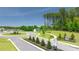 New construction community with landscaped roundabout, sidewalks and new homes at 1628 Palladian Dr, Lithonia, GA 30058
