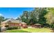 Expansive backyard features a pool, gazebo with seating, and manicured lawn at 2065 Innsfail Dr, Snellville, GA 30078