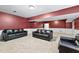 Spacious basement featuring comfortable seating, ideal for gatherings and relaxation at 2065 Innsfail Dr, Snellville, GA 30078