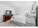 Cozy bedroom with soft carpeting, a dresser with TV, and a comfortable bed at 2065 Innsfail Dr, Snellville, GA 30078
