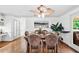 Bright dining room with hardwood floors, decorative ceiling fan, and French doors to an outdoor patio at 2065 Innsfail Dr, Snellville, GA 30078