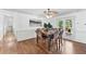 Bright dining room with hardwood floors, decorative ceiling fan, and French doors to an outdoor patio at 2065 Innsfail Dr, Snellville, GA 30078