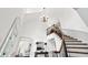 Bright foyer featuring a curved staircase and chandelier, with views to adjacent rooms at 2065 Innsfail Dr, Snellville, GA 30078