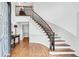 Open foyer features a curved staircase with wood treads and iron spindles at 2065 Innsfail Dr, Snellville, GA 30078