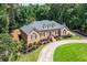Beautiful brick home with landscaped front yard and a well-maintained lawn at 2065 Innsfail Dr, Snellville, GA 30078
