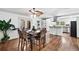 Open kitchen and dining area featuring stainless steel appliances, ample cabinetry, and hardwood floors at 2065 Innsfail Dr, Snellville, GA 30078