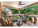Outdoor patio oasis with comfortable seating, lush greenery, and a gazebo at 2065 Innsfail Dr, Snellville, GA 30078