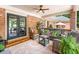 Inviting covered patio featuring comfortable seating and stylish decor, perfect for outdoor relaxation and entertaining at 2065 Innsfail Dr, Snellville, GA 30078