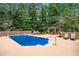 Private backyard pool with inviting lounge chairs, a charming gazebo, and well-manicured landscaping for summer enjoyment at 2065 Innsfail Dr, Snellville, GA 30078