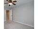 Spacious carpeted bedroom with ceiling fan and neutral paint at 655 Golden Meadows Ln, Suwanee, GA 30024