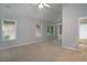 Spacious bedroom with neutral carpet, natural light, and ensuite bathroom entrance at 655 Golden Meadows Ln, Suwanee, GA 30024