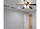 Neutrally painted bedroom with a ceiling fan and closet doors at 655 Golden Meadows Ln, Suwanee, GA 30024