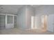 Bright bedroom featuring carpet, vaulted ceiling, built-in shelving and ensuite access at 655 Golden Meadows Ln, Suwanee, GA 30024