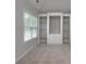 Carpeted bedroom featuring built-in shelving and a large window at 655 Golden Meadows Ln, Suwanee, GA 30024