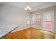 Sunny breakfast nook with granite countertop, windows, and access to the outdoor deck at 655 Golden Meadows Ln, Suwanee, GA 30024