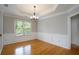 Dining room featuring elegant trim, large windows, and a stylish chandelier at 655 Golden Meadows Ln, Suwanee, GA 30024