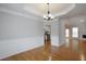 Dining room featuring elegant trim, large windows, and hardwood floors at 655 Golden Meadows Ln, Suwanee, GA 30024