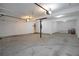 Large two-car garage with white walls and lots of room at 655 Golden Meadows Ln, Suwanee, GA 30024