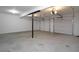 Spacious garage with a concrete floor and an automatic door at 655 Golden Meadows Ln, Suwanee, GA 30024