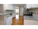 Modern kitchen with granite countertops, stainless steel appliances, and ample cabinet space at 655 Golden Meadows Ln, Suwanee, GA 30024