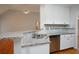 Bright kitchen featuring granite countertops, stainless steel appliances, and ample cabinet space at 655 Golden Meadows Ln, Suwanee, GA 30024