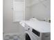 Functional laundry room with washer, dryer, and storage space at 655 Golden Meadows Ln, Suwanee, GA 30024