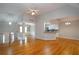 Open-concept living area with hardwood floors, seamlessly connecting to the kitchen and dining areas at 655 Golden Meadows Ln, Suwanee, GA 30024