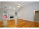 Bright living room with hardwood floors, fireplace, and large windows showcasing outdoor views at 655 Golden Meadows Ln, Suwanee, GA 30024