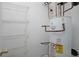 Utility room with shelving and hot water heater at 655 Golden Meadows Ln, Suwanee, GA 30024
