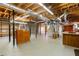 Unfinished basement featuring exposed ductwork, wooden beams, and ample space for storage or future expansion at 115 Flagstop Run, Fayetteville, GA 30215