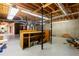 Large unfinished basement with exposed ductwork and support beams, offering plenty of potential for customization at 115 Flagstop Run, Fayetteville, GA 30215